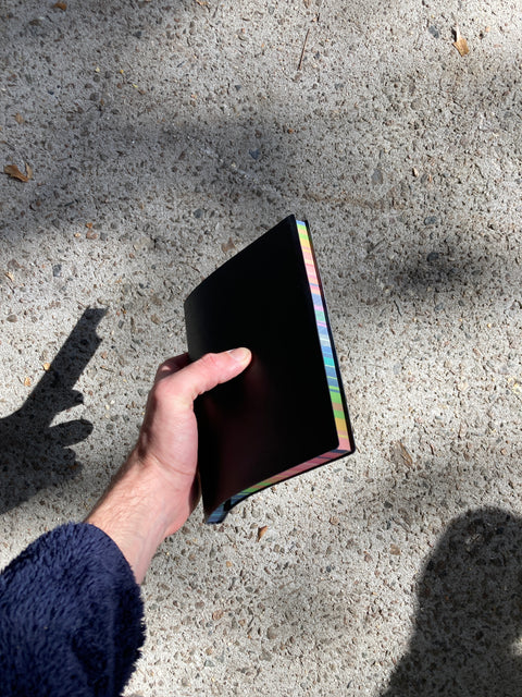 Black Ruled Notebook With Rainbow Side