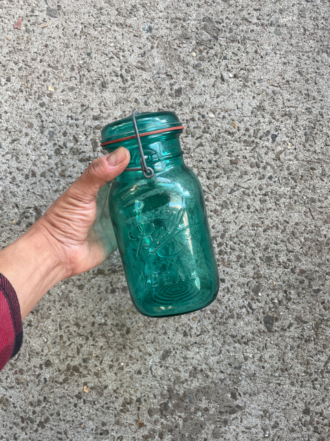 A Vintage Green Glass Resealable Ball Jar