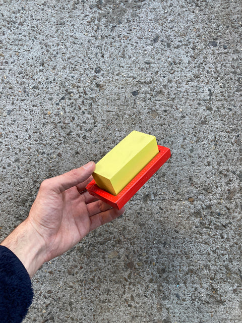 A Stack Of Sticky Notes That Looks Like A Block Of Butter