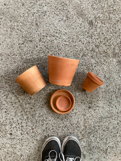 A Small, A Medium And A Large Terra Cotta Pots