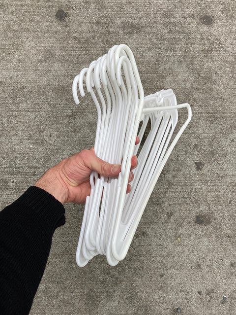 14 White Plastic Hangers