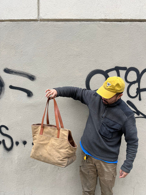 A Pretty Looking Leather & Canvas Tote To Carry A Pet