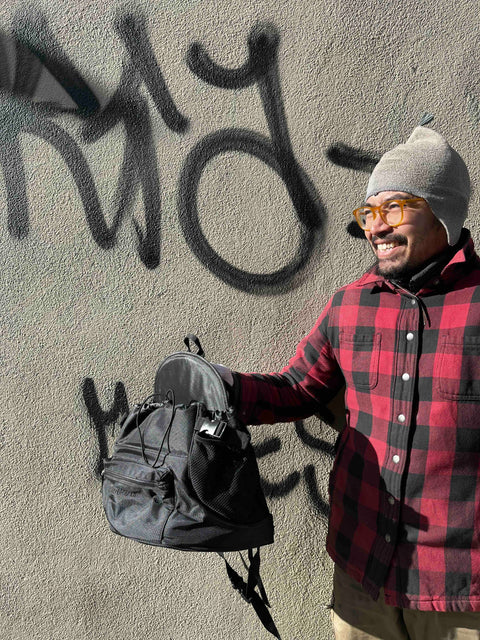 A Stylish Black Backpack To Carry A Pet