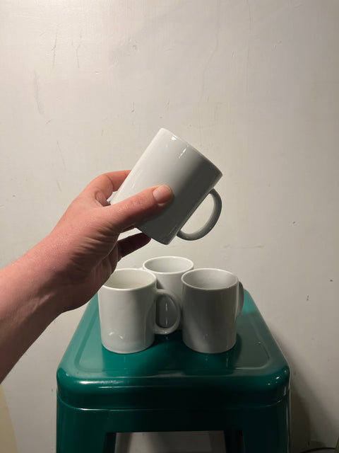 Four white mugs