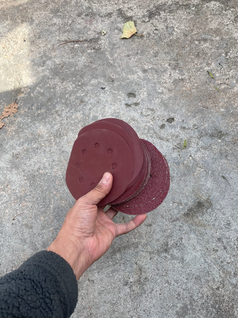 A Grip of Various Grades of Rotary Sanding Pads