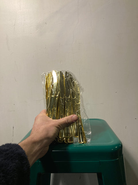 Bunch Of Gold Plastic Knives