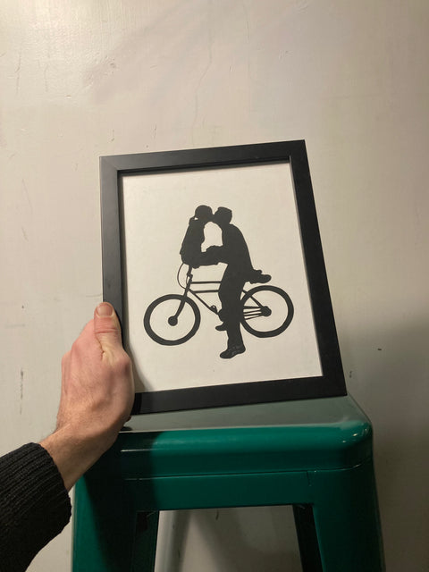 People On a Bike Frame